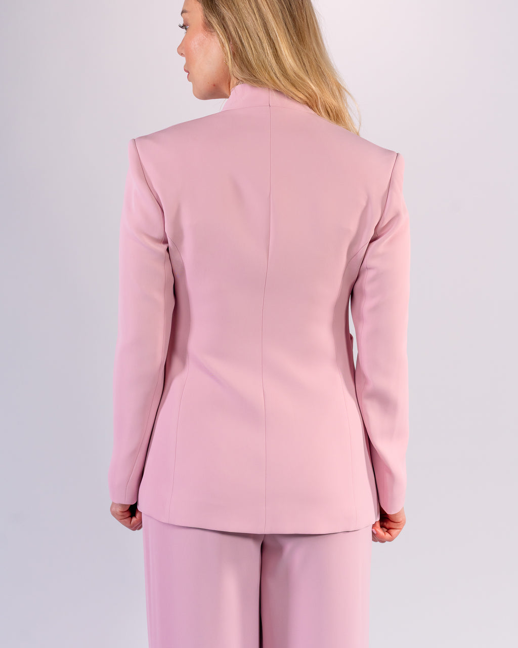 Shawl-collar, single-button, and palazzo-cut suit in Pink