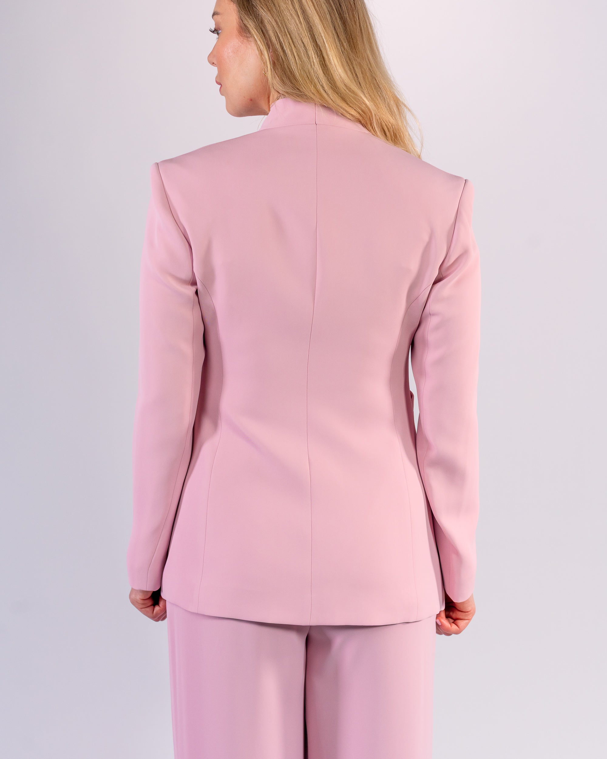 Shawl-collar, single-button, and palazzo-cut suit in Pink
