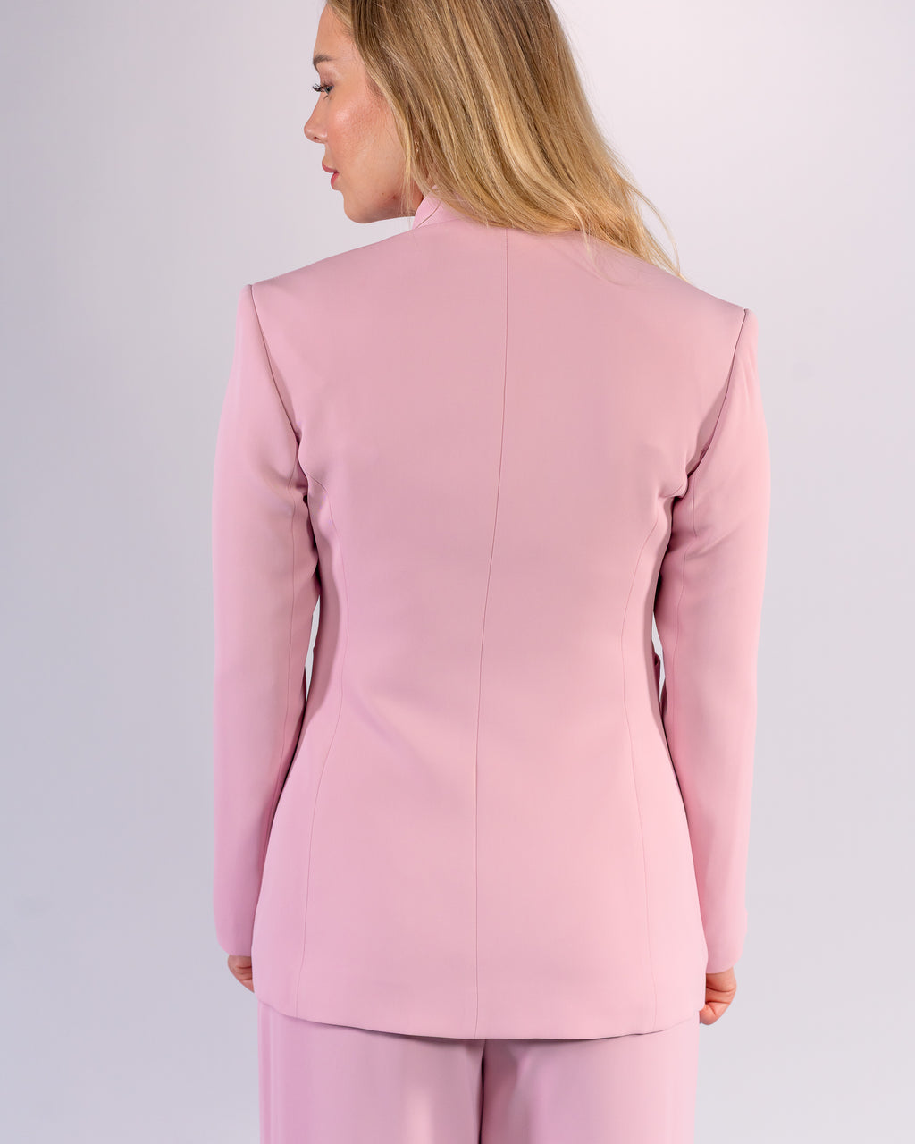 Shawl-collar, single-button, and palazzo-cut suit in Pink